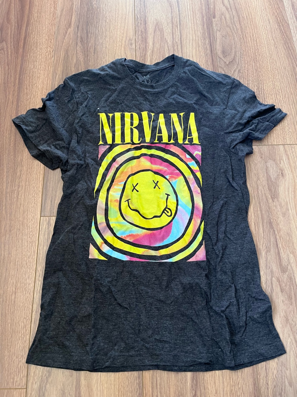 NIRVANA Black Tee with Neon Tie-Dye Smiley Graphic